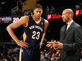 Head coach Monty Williams of the New Orleans Pelicans talks to Anthony Davis during a break in the action against the Cleveland Cavaliers at The Quicken Loans Arena on January 28, 2014. (David Liam Kyle/NBAE via Getty Images/AFP)