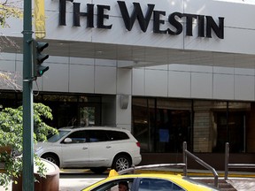 A taxi parked in front of the Westin Hotel, 10135 - 100 St., in Edmonton Alta., on Tuesday Sept. 2, 2014. David Bloom/Edmonton Sun