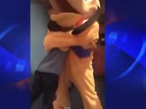 A California woman said her eight-year-old son suffered injuries to his back and neck after a Disneyland actor dressed as Pluto hugged the boy.
(Screenshot from YouTube)