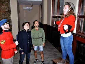 Western University opera students Thomas Krasey (left), Anthony Rodrigues, Cesar Aguilar and Amanda Bartella rehearse a scene from La File du Regiment in London Ont. May 4, 2015. CHRIS MONTANINI\LONDONER\POSTMEDIA NETWORK