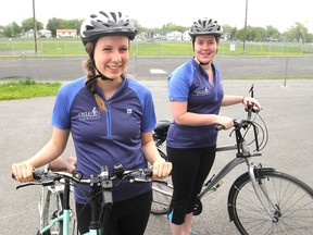 Simone Brechin, left, and Natasha Klink are this summer's new cycling ambassadors. Their mandate is to go to schools and other community events and promote safe cycling. The post is a project of Cycle Kingston. (Michael Lea/The Whig-Standard)