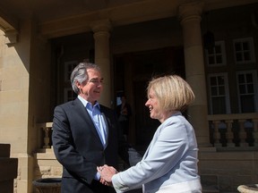Then-Alberta premier Jim Prentice and premier designate Rachel Notley shake hands as they leave Government House following a meeting, in Edmonton, Alta. on Tuesday May 12, 2015. David Bloom/Edmonton Sun