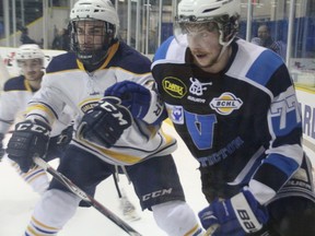 Lewis Zerter-Gossage is pressured by a Carleton Place forechecker during the Penticton Vees' 4-3 win over the Carelton Place Canadians on Tuesday, May 12 at the 2015 RBC Cup in Portage la Prairie, Man. The loss was Carleton Place's first of the tournament. (Matt Hermiz/Postmedia Network)