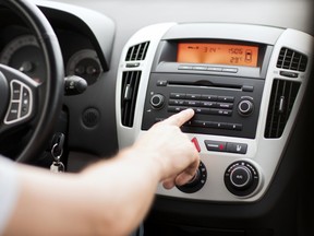 reaching for radio dial while driving