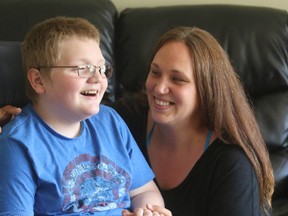 Sarah Orr and her 10-year-old son, Owen, who suffers from mitochondrial disease, at their home in Port Hope on Tuesday, May 12, 2015. (Pete Fisher/Postmedia Network)