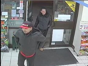 Toronto Police released surveillance video of two men sought in an assault on a cab driver May 8, 2015.