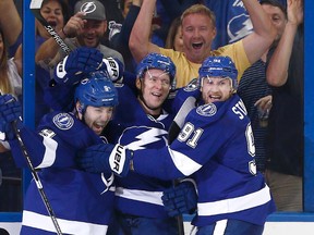 Lightning left wing Ondrej Palat (centre), centre Tyler Johnson (left) and Steven Stamkos (right) celebrates a goal against the Canadiens during second period NHL playoff action in Tampa, Fla., on Tuesday, May 12, 2015. (Reinhold Matay/USA TODAY Sports)