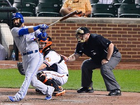 Toronto Blue Jays right fielder Jose Bautista hits a ground rule double during the seventh inning against the Baltimore Orioles at Oriole Park at Camden Yards on May 12, 2015. (TOMMY GILLIGAN/USA TODAY Sports)