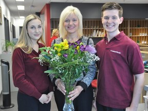 Supplied photo
Ava Danyluk, Grade 12 - Student Council vice president, and Owen Krystia, Grade 12 - Student Council president, present St. Charles College principal Patty Mardero with flowers as one of this year's recipients of the C.P.C.O. Principal of the Year awards.