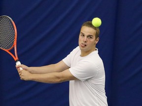 Sebastien Dugas-Ruest, of College Notre-Dame, competes in the boys' singles category at the local high school tennis championships at the Sudbury Indoor Tennis Centre in Sudbury, Ont. on Tuesday May 12, 2015.