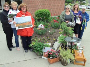 Members of the Tillsonburg Horticultural Society display a few of the items that will be available next Tuesday, May 19, in the 9th annual Garden Auction at the Lions Auditorium, Tillsonburg Community Centre, including garden ornaments, bird houses, stool, shrubs, trees, flowers and art. From left are Judi Misener, Marian Smith, Catherine Burke, Jan Torrell, Juley Van Daalen, and Mignonne Trepanier. (CHRIS ABBOTT/TILLSONBURG NEWS)