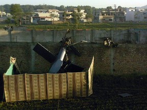In this photograph taken on May 2, 2011, a crashed military helicopter is seen near the hideout of al-Qaida leader Osama bin Laden after a ground operation by U.S. Special Forces in Abbottabad, Pakistan. (AFP PHOTO)