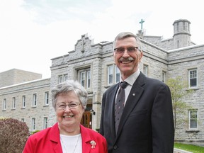 Sister Sandra Shannon, Sisters of Providence of St. Vincent de Paul general superior, and Peter Merkley, Providence Care board chair, pose for a photo outside Mother House at 1200 Princess St. during a media conference in Kingston on Wednesday. They announced a new partnership project that would see the creation of Providence Village, a community neighbourhood on the 30-acre property, which would include relocating Providence Manor. (Julia McKay/The Whig-Standard)