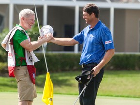 Padraig Harrington (right) celebrates with his caddy Ronan Flood after winning the the Honda Classic on the second playoff hole in Palm Beach Gardens, Fla., on March 2, 2015. (Peter Casey/USA TODAY Sports)