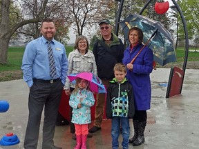 Submitted photo: Royal Bank of Canada recently made a $1,000 donation to the Port Lambton splash pad project. Making the donation, from left to right, Travis Hooper, RBC Wallaceburg/Port Lambton branch manager, Splash Pad Committee secretary Ann Cram, and co-chairs David Cram and Anne Hazzard. Standing in front, eagerly anticipating the Splash Pad opening are Secily and Oliver Hooper.