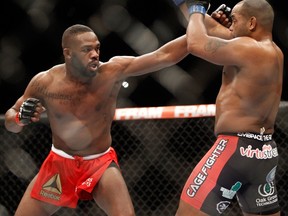 Jon Jones (left) tries to punch Daniel Comier during UFC 182 in Las Vegas on Jan. 3, 2015. (Steve Marcus/Getty Images/AFP)