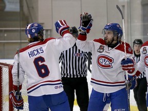Kingston Voyageurs' Ryan Watson, right, celebrates his goal with Josh Hicks during Game 6 of an Ontario Junior Hockey League North-East conference semifinal playoff series against Aurora at the Invista Centre on March 22. (Ian MacAlpine/The Whig-Standard)