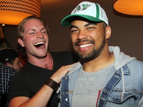 Nic Demski celebrates being drafted by the Saskatchewan Roughriders at a Winnipeg bar on Tuesday night.