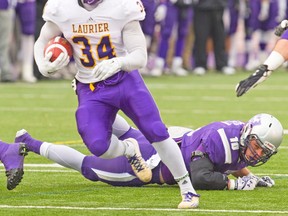 Laurier’s Dillon Campbell, running for a touchdown against Western late last season, was a fifth-round pick of the Argonauts on Tuesday. (MIKE HENSON, Postmedia Network files)
