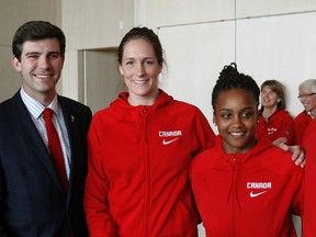 Mayor Don Iveson poses with (from left) Kia Nurse, Krysten Boogaard, Shay Colley and Saicha Grant-Allen during a reception for players at the national women's team camp Wednesday at city hall. (Tom Braid, Edmonton Sun)