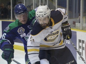 Owen Stewart is pressured by a Melfort forechecker in the first period of the Melfort Mustangs and Carleton Place Canadians game at the 2015 RBC Cup Junior A national championship on May 13 in Portage la Prairie, Man. (Matt Hermiz/TheGraphic/Postmedia Network)