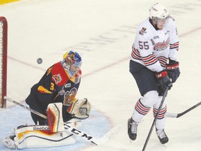 Michael McCarron of the Oshawa Generals lets a shot go past that beats Erie Otters goalie Devin Williams for a goal during Game 4 of the OHL final series in Erie, Pa. The goal was scored by Mitchell Vande Sompel.  (JACK HANRAHAN/Special to Postmedia Network)