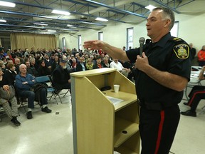 Police Staff Sgt. Rob Harding speaks to the crowd at a River Heights forum on Wednesday. (KEVIN KING/Winnipeg Sun)