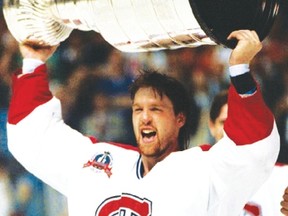 Canadiens goalie Patrick Roy hoists the Stanley Cup in 1993. (AFP file)