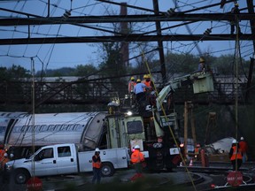 PHILADELPHIA, PA - MAY 13: Repair crews inspect damages at the site of a train derailment accident May 13, 2015 in Philadelphia, Pennsylvania. Service has been interrupted after an Amtrak train derailed in Philadelphia last night, killing at least seven people and injured more than 200.   Alex Wong/Getty Images/AFP== FOR NEWSPAPERS, INTERNET, TELCOS & TELEVISION USE ONLY ==