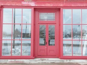 The front of the shop after it was restored. It has all new windows, including new glass in the doors. The top of the door now has a restored window where it was once boarded up. (Contributed photo)