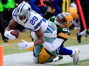DeMarco Murray of the Dallas Cowboys scores a touchdown despite the efforts of Ha Ha Clinton-Dix of the Green Bay Packers during the 2015 NFC divisional playoff game at Lambeau Field on January 11, 2015 in Green Bay. (Rob Carr/Getty Images/AFP)