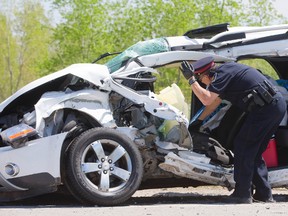 A woman was airlifted to hospital with serious injuries after apparently doing a U-turn in front of a loaded cement truck northbound on Clarke Rd., just south of Fanshawe Park Rd., in London, Thursday. (MIKE HENSEN, The London Free Press)