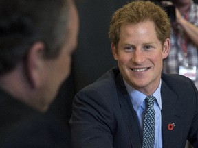 Britain's Prince Harry speaks to war veterans during a visit to the War Memorial Centre on his visit to Whanganui, May 14, 2015. (REUTERS/Marty Melville/POOL)