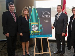 (From left to right) Pierre Lemieux, MP for Glengarry-Prescott-Russell, Shelly Glover, Minister of Canadian Heritage and Official Languages, Christopher Donnolly, VP and Counsel, Manulife and Nathalie Gélinas, VP and producer, Idées au cube unveil the logo for Parliament Hill's newest laser light show, Northern Lights. (Photo courtesy/Canadian Heritage)