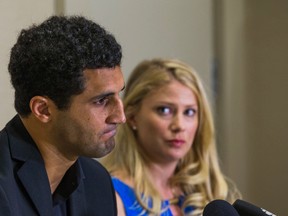 Canadian hockey player Andre Deveaux, along with his wife Anya Nordstrom, addresses the media during a press conference at the Sheraton Hotel in Toronto Friday May 8, 2015. (Ernest Doroszuk/Toronto Sun/Postmedia Network)