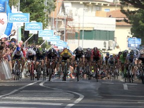 German Andre Greipel sprints in the finish line to win the sixth stage of the Giro d'Italia cycling race between Montecatini Terme and Castiglione della Pescaia on May 14, 2015 in Castiglione della Pescaia. (AFP PHOTO/LUK BENIES)