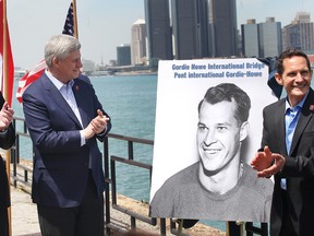 Michigan Governor Rick Snyder, Prime Minister Stephen Harper and Murray Howe, Gordie Howe's son, announce that the Detroit River International Crossing will be named the Gordie Howe International Bridge, on the waterfront, Windsor, Ont., on May 14, 2015. (DAN JANISSE/The Windsor Star)