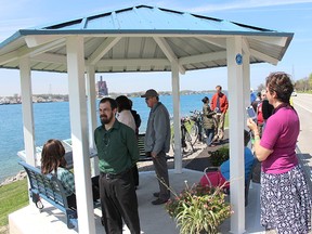 Bluewater Trails members, Shell officials and others gathered for the grand opening of the trail group's new River Road Nwebin Wiigwaamens Gazebo and Interpretive Centre Thursday. The gazebo is the final piece in a nearly decade-long project linking trails in Sarnia with those in St. Clair Township. (Tyler Kula/Sarnia Observer/Postmedia Network)