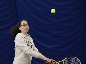 Gabrielle Nellis, of Ecole secondaire Macdonald-Cartier, competes in the girls' singles category at the local high school tennis championships at the Sudbury Indoor Tennis Centre in Sudbury, Ont. on Thursday May 14, 2015.