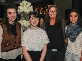 Visual artist co-mentor Kelsey Haynes, left, Grade 10 Sydenham High School student Kate Gibson, co-mentor Suzy Lamont and Odessa Public School student Samantha Fenwick pose for a photo at the Limestone Learning Foundation's Crystal Ball mentorship pairings announcement at the Rogers K-Rock Centre on Thursday. (Julia McKay/The Whig-Standard)