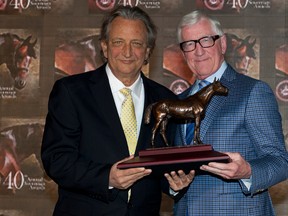 Senators owner Eugene Melnyk receives a Sovereign Award earlier this year. (Woodbine Entertainment Group)