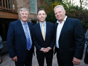 Former Ontario premier Mike Harris and new Ontario PC leader Patrick Brown are welcomed at a reception by Doug Ford at the Ford family home in Etobicoke on May 14, 2015. (Michael Peake/Toronto Sun)
