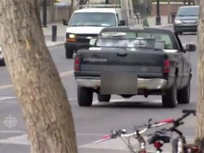 Screen grab from a YouTube video of a CBC street interview last from April 2015, when a truck passed by and someone in it yelled obscenities at the camera crew. (YouTube/CBC News)