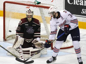 Oshawa?s Hunter Smith, right, who watched Windsor win a pair of Memorial Cup titles as a youngster, is now the veteran physical force on an Oshawa squad that is one win shy of dusting off the Erie Otters.