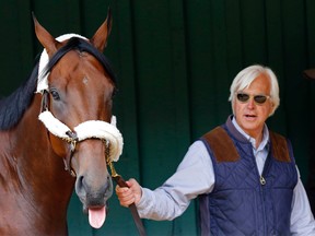 Trainer Bob Baffert walks American Pharaoh. (USA Today Sports)