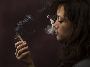 Woman smoking marijuana joint pot
