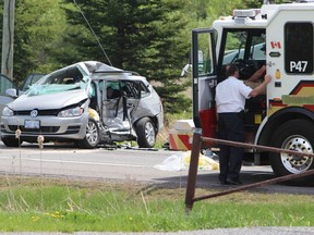 A woman is fighting for her life in an Ottawa hospial after her vehicle was T-boned by a truck at the intersection of Limebank and Mitch Owens roads just outside Manotick Friday, May 15, 2015. (DOUG HEMPSTEAD Ottawa Sun)
