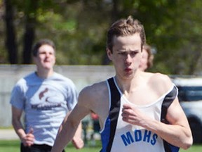 James Cooper of MDHS powers his way to a first place finish in the junior boys 100m race. MARK DEWAN PHOTO