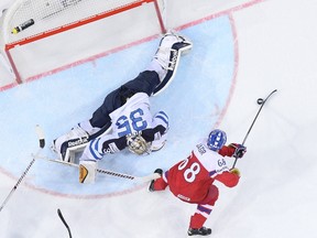 Forward Jaromir Jagr (C) of Czech Republic shoots to score past goalkeeper Pekka Rinne of Finland during the quarter final match Finland vs Czech Republic at the 2015 IIHF Ice Hockey World Championships on May 14, 2015 at the O2 Arena in Prague.  AFP PHOTO/JONATHAN NACKSTRAND
