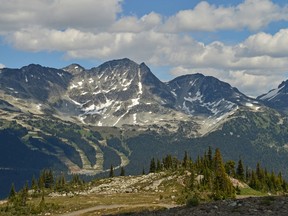 A wide view of ski slopes and snow-covered peaks at Whistler Blackcomb. (Fotolia)